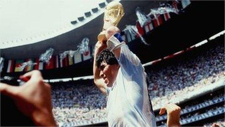 Argentina's Diego Maradona lifts the World Cup trophy in 1986