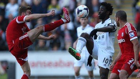 West Brom's James Morrison challenges Swansea's Wilfried Bony for the ball