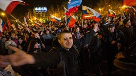 Pro-Russian people celebrate in the central square in Sevastopol, Ukraine