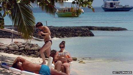 Tourists on a Maldives beach