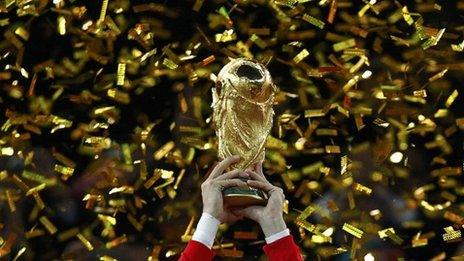 Gerard Pique of Spain holds the FIFA World Cup trophy after the 2010 World Cup final