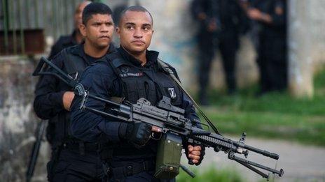 Heavily-armed police patrol a shanty town in Rio de Janeiro, on March 13, 2014