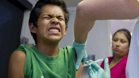A California child receives an immunisation shot.