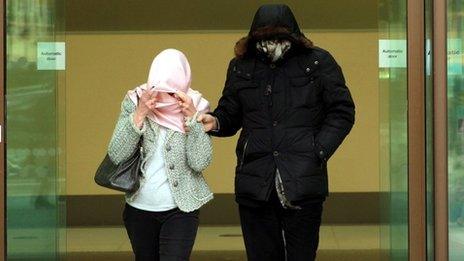 Domenico Rancadore and his wife had their faces covered as they left Westminster Magistrates' Court