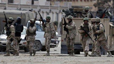 Policemen arrive at the site of an attack in Kabul