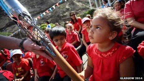 Primary school pupil with the Queen's baton in St Helena