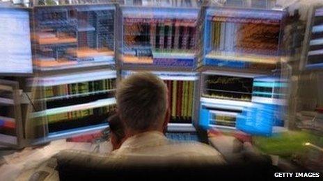 trader in front of screen