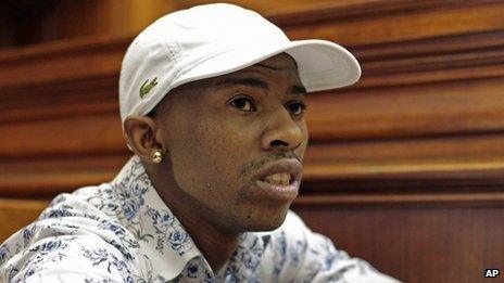 Xolile Mngeni sits in the dock in a courtroom, in Cape Town, South Africa on 19 November 2012