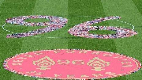 Scarves from English football clubs make a 96 on Anfield's pitch