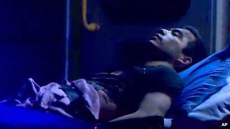 Matthew Douglas de Grood, of Calgary, is shown in this still image taken from video, courtesy Global News, on a stretcher in Calgary on 15 April 2014