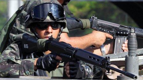 Brazilian soldiers patrol the streets in Salvador, state of Bahia, on February 5, 2012.