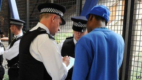 Police officers conduct a stop and search in 2008