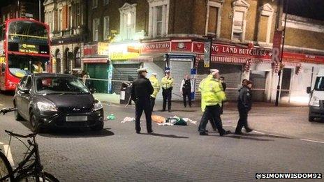 Woman hit by unmarked police car in London - BBC News