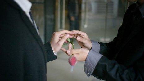 A gay couple exchange rings during their ceremonial "wedding" as they try to raise awareness of the issue of homosexual marriage in central China's Hubei province (March 2011)