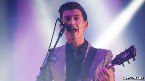 Alex Turner of the Arctic Monkeys performs live on the Pyramid Stage at day 2 of the 2013 Glastonbury Festival