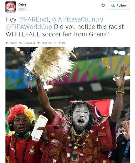 A tweet showing an image of a black fan with white face paint on at the World Cup, and the words "Hey @FARENET, @AfricasaCountry @FIFAWorldCup Did you notice this racist WHITEFACE soccer fan from Ghana?