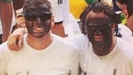 A photo of two fans with their faces blacked-up and t-shirts saying "Ghana" posted to Instgram by Jason Spears