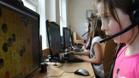 young girls learning to code