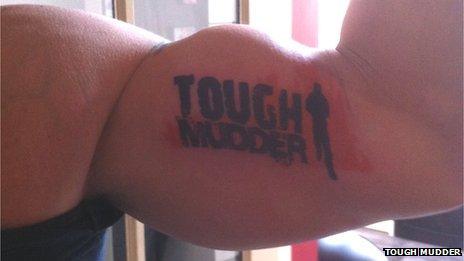 A Tough Mudder tattoo on a man's arm