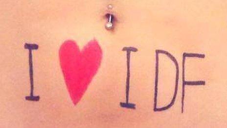 A woman's stomach with the words "I love IDF"