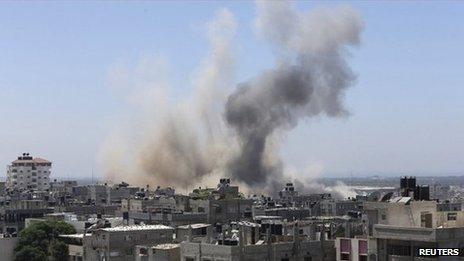 Smoke rising over buildings in Gaza
