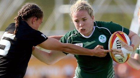 Ireland's Niamh Briggs is tackled by Selica Winiata of New Zealand