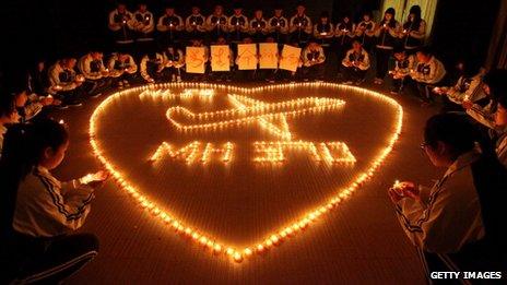 Students praying for flight MH370