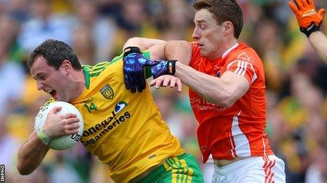 Donegal forward Michael Murphy is challenged by Charlie Vernon in the All-Ireland quarter-final