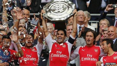 Arsenal players celebrate with Community Shield