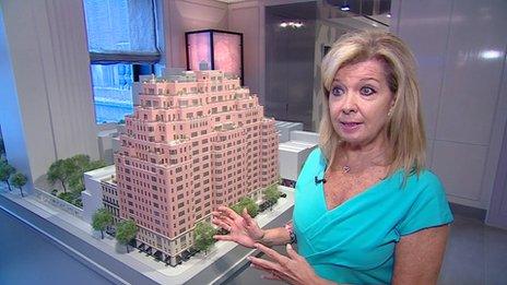 Nikki Field, estate agent, in front of model of Carlton House flat complex