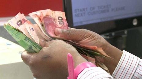 Counting cash in South Africa supermarket
