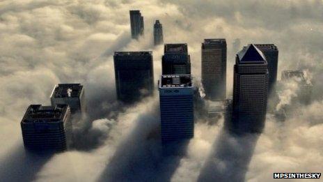 London office blocks shrouded in clouds