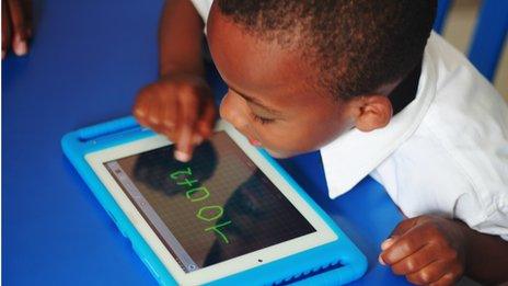A child doing sums on the Qelasy tablet