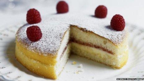 Raspberry sponge cake with slice taken out