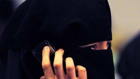 A woman wearing a burka talks on a mobile phone in Sydney. Photo: July 2011