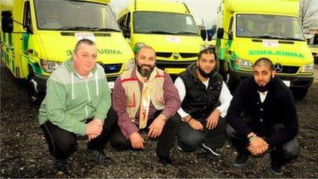 Alan Henning with convoy members and ambulance