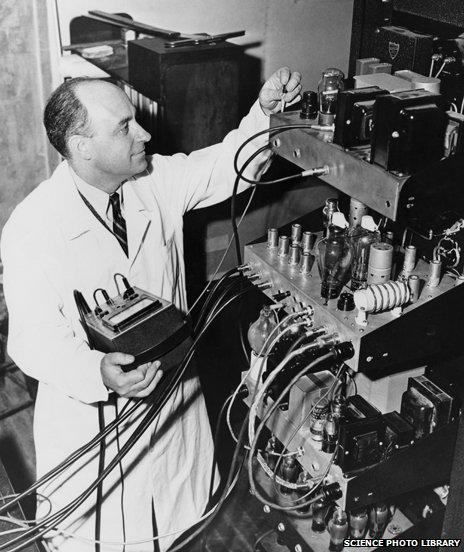 Enrico Fermi with electronic equipment for the University of Chicago's particle accelerator