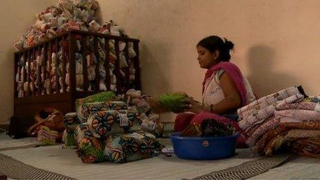 Women making sanitary towels in India from recycled cloths