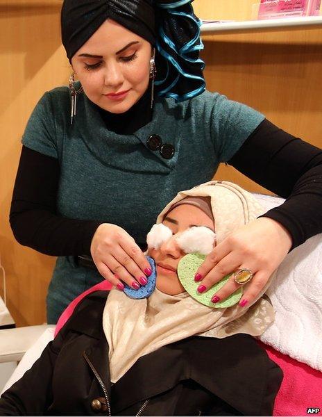 A woman having a facial treatment at a skin care and health care exhibition which was held in Damascus early in December.