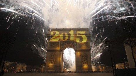 New Year"s fireworks erupt over the Arc de Triomphe (01 January 2015)
