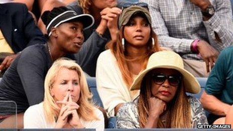 Williams family members watch Serena play tennis