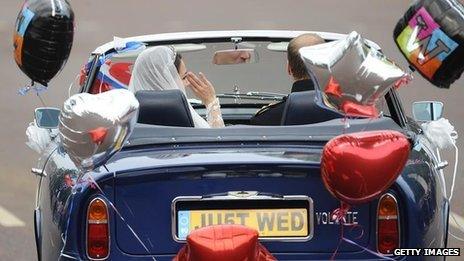 Prince William, Duke of Cambridge, driving his newly titled bride Catherine, Duchess of Cambridge, from Buckingham Palace