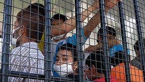 Suspected Uighurs are transported to a detention facility in the town of Songkhla in southern Thailand