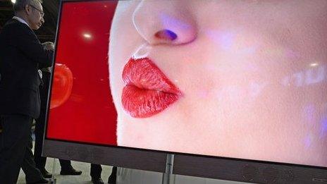 woman pouting on giant TV Screen