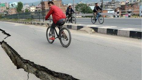 Damaged roads are seen after an earthquake on the outskirts of Kathmandu on April 26, 2015.