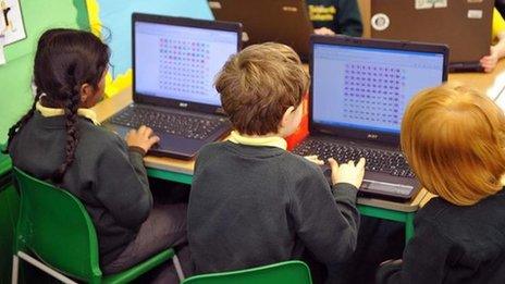 Primary school pupils using a computer