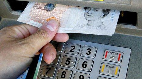 £10 note being taken out of cash machine