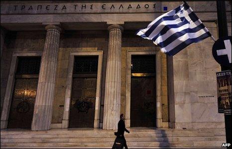 Man walks past Greek Central bank