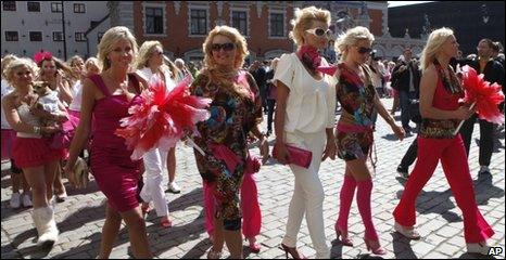 Blonde women march through Riga, Latvia, 29 May