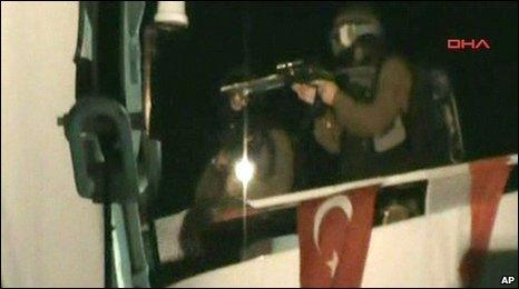 Video image released by the Turkish Aid group IHH which purports to show Israeli soldiers on the deck of a Turkish ship